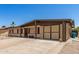 Inviting single-level home showcasing a covered carport and cozy front bench, enhancing its welcoming charm at 18217 N 34Th Ave, Phoenix, AZ 85053