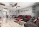 Inviting living room with hardwood floors, a ceiling fan, and ample seating for relaxation and entertaining at 18217 N 34Th Ave, Phoenix, AZ 85053