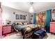 Unique primary bedroom featuring colorful décor, brick walls, and a cozy, relaxed atmosphere at 18217 N 34Th Ave, Phoenix, AZ 85053