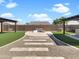 Expansive backyard featuring an outdoor firepit, gravel landscaping, and manicured artificial turf at 18389 W Long Lake Rd, Goodyear, AZ 85338
