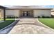 Outdoor living space featuring a covered patio, manicured lawn, and decorative landscaping at 18389 W Long Lake Rd, Goodyear, AZ 85338