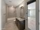 Bathroom with walk-in shower and tub at 18389 W Long Lake Rd, Goodyear, AZ 85338
