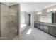 Bathroom with double vanity, walk-in shower, and tub at 18389 W Long Lake Rd, Goodyear, AZ 85338