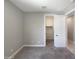 Neutral bedroom with carpet and walk-in closet with shelving at 18389 W Long Lake Rd, Goodyear, AZ 85338