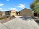 Inviting single-story home featuring a neutral color palette, tile roof, and a spacious three-car garage at 18389 W Long Lake Rd, Goodyear, AZ 85338