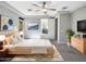 Spacious main bedroom with ensuite bathroom access, neutral walls, and a ceiling fan at 18389 W Long Lake Rd, Goodyear, AZ 85338