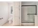 Bright bathroom with tiled floors, toilet, and glass shower at 201 S 91St St, Mesa, AZ 85208