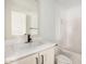 Bathroom featuring bright white tiles, a vanity, and toilet at 201 S 91St St, Mesa, AZ 85208