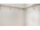 Walk-in closet features wooden racks for optimal storage at 201 S 91St St, Mesa, AZ 85208