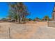 This property features a spacious yard and is conveniently located near various commercial trucks at 201 S 91St St, Mesa, AZ 85208