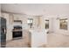 Modern kitchen with stainless appliances, white cabinetry, a center island, and ample natural light at 201 S 91St St, Mesa, AZ 85208