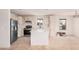 Newly renovated kitchen boasts stainless appliances, white cabinetry, and a functional island at 201 S 91St St, Mesa, AZ 85208