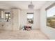 Kitchen featuring modern white cabinets, a stylish sink, and ample natural light at 201 S 91St St, Mesa, AZ 85208