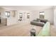 Spacious living room with natural light featuring large windows and prepped for flooring at 201 S 91St St, Mesa, AZ 85208