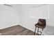 A bright bedroom featuring hardwood floors and a modern air conditioning unit at 2607 E Mercer Ln, Phoenix, AZ 85028