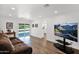 Bright living room featuring neutral paint, vinyl flooring, recessed lights, and backyard views at 2607 E Mercer Ln, Phoenix, AZ 85028