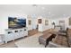 Spacious living room with modern decor, wood flooring, and ample natural light at 2607 E Mercer Ln, Phoenix, AZ 85028
