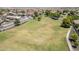Aerial view of the neighborhood with grassy fields and sidewalks at 2717 W Bowker St, Phoenix, AZ 85041