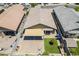 Aerial view of a backyard with a covered patio, artificial grass, and brick-paved patio at 2717 W Bowker St, Phoenix, AZ 85041