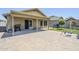 Outdoor patio with covered seating area, swing set, and well-maintained landscaping for outdoor enjoyment at 2717 W Bowker St, Phoenix, AZ 85041