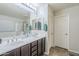 Bathroom boasts double sinks, a shower, and great lighting fixtures at 2717 W Bowker St, Phoenix, AZ 85041
