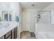 Bathroom with a shower, bathtub, and a vanity with double sinks at 2717 W Bowker St, Phoenix, AZ 85041