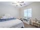 This bedroom features a ceiling fan, a comfortable bed, and plenty of toy storage at 2717 W Bowker St, Phoenix, AZ 85041