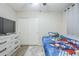 Bedroom features a ceiling fan, closet, and a chest of drawers at 2717 W Bowker St, Phoenix, AZ 85041