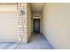 Exterior shot of the front door with decorative iron work and a covered entryway at 2717 W Bowker St, Phoenix, AZ 85041
