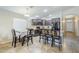 Kitchen with dark cabinets, granite countertops, stainless steel appliances and breakfast nook at 2717 W Bowker St, Phoenix, AZ 85041