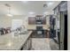 Well-appointed kitchen features granite countertops, and stainless steel appliances at 2717 W Bowker St, Phoenix, AZ 85041