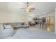 Open-concept living room features ceiling fan and connects to the dining area and kitchen at 2717 W Bowker St, Phoenix, AZ 85041