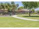 Community sidewalks surrounded by lush grass and landscaping at 2717 W Bowker St, Phoenix, AZ 85041