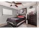Cozy bedroom with ceiling fan and wood-style flooring at 2749 W San Juan Ave, Phoenix, AZ 85017
