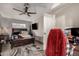 Bedroom with ceiling fan, mounted television and convenient access to closet via door at 2749 W San Juan Ave, Phoenix, AZ 85017