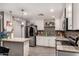 Kitchen featuring stainless steel appliances, granite countertops, and wooden floors at 2749 W San Juan Ave, Phoenix, AZ 85017