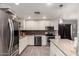 Well-lit kitchen with stainless steel appliances and stylish backsplash at 2749 W San Juan Ave, Phoenix, AZ 85017