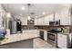 Bright kitchen featuring stainless steel appliances, granite countertops, and white cabinets at 2749 W San Juan Ave, Phoenix, AZ 85017