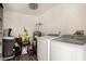 Well-equipped laundry room with washer, dryer, and utility sink for added convenience at 2749 W San Juan Ave, Phoenix, AZ 85017
