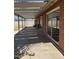 Spacious covered back patio featuring a smooth concrete floor and access to the backyard, perfect for outdoor relaxation at 3006 W Stella Ln, Phoenix, AZ 85017