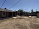 The home's backyard offers plenty of space, a covered patio, and landscaping features at 3006 W Stella Ln, Phoenix, AZ 85017