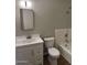 Updated bathroom features a modern vanity, sleek fixtures, and a bathtub with a shower at 3006 W Stella Ln, Phoenix, AZ 85017