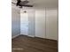 Bedroom features large closet, door and a ceiling fan for added comfort at 3006 W Stella Ln, Phoenix, AZ 85017