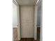 Hallway with built-in cabinet and updated flooring, offering great storage at 3006 W Stella Ln, Phoenix, AZ 85017