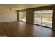 Bright living room features new flooring and expansive sliding glass doors leading to the backyard and patio at 3006 W Stella Ln, Phoenix, AZ 85017