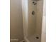 Bathroom features a tiled shower, offering a clean and modern space at 3006 W Stella Ln, Phoenix, AZ 85017