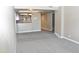 Spacious living room featuring plush carpeting, neutral paint, and a sliding glass door at 3420 W Danbury Dr # C130, Phoenix, AZ 85053