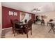 Open dining area with wooden table set and views into an adjacent desk area at 3529 W Saint Moritz Ln, Phoenix, AZ 85053