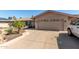 Charming single-story home with a two-car garage, desert landscaping and inviting curb appeal at 3529 W Saint Moritz Ln, Phoenix, AZ 85053