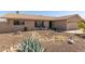 Single-story home with desert landscaping and a cozy outdoor seating area on the front porch at 3529 W Saint Moritz Ln, Phoenix, AZ 85053